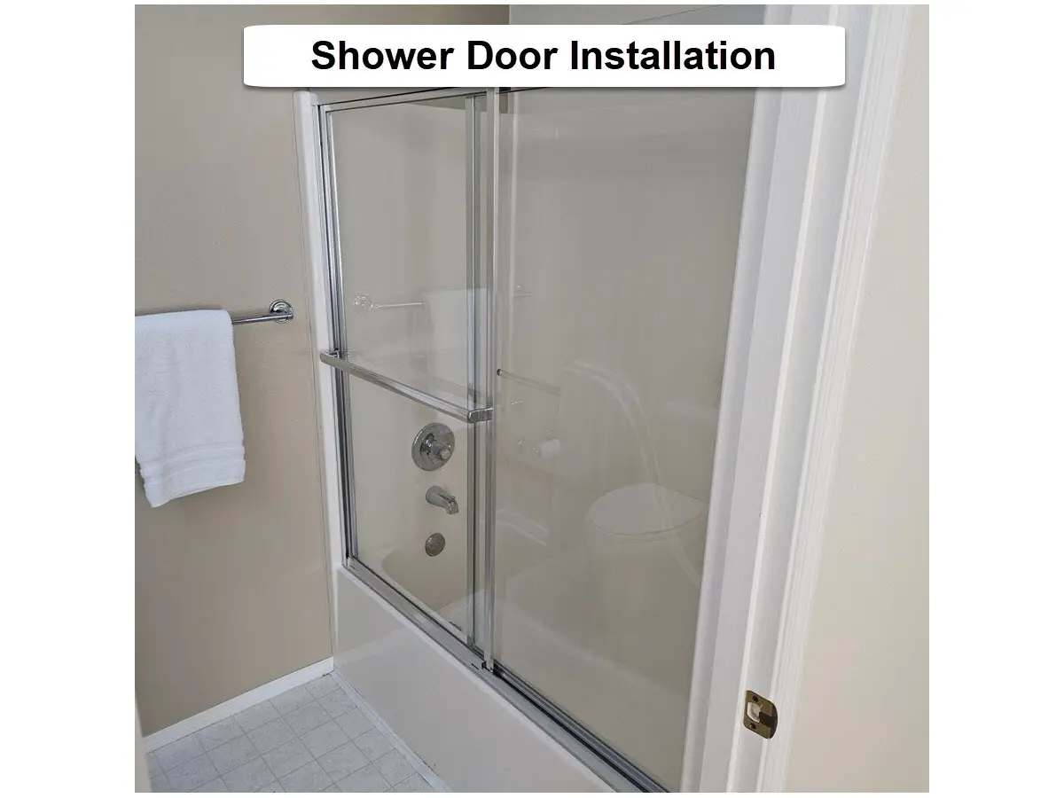 Shower door installation in NW Portland showing a new framed glass sliding shower door installed in a bathroom tub enclosure