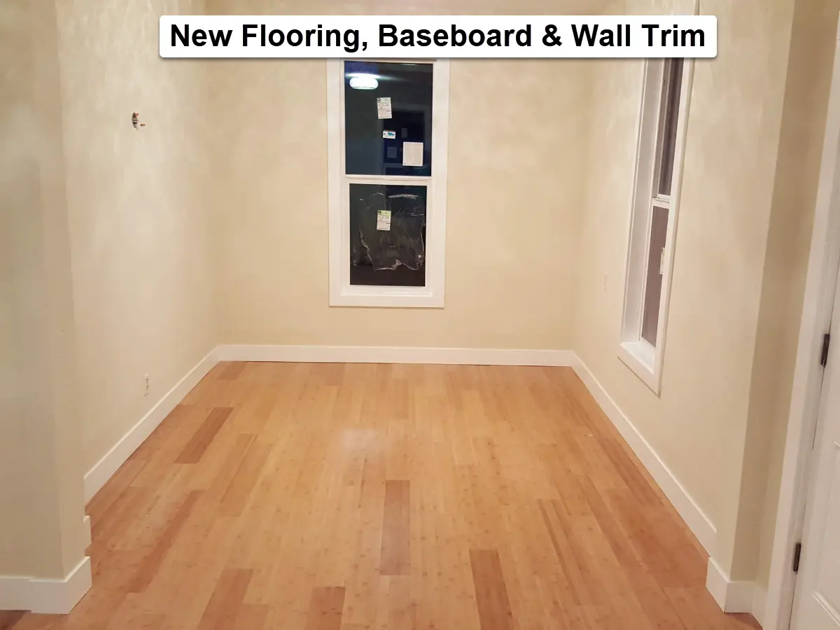 New flooring with baseboard and wall trim installed in living space in SW Portland, Oregon